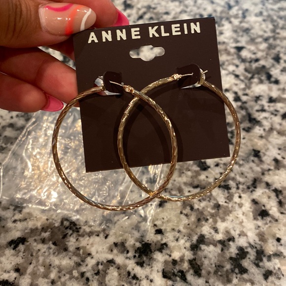 These Anne Klein medium size hoop earrings are gold and very light weight! - Picture 1 of 2